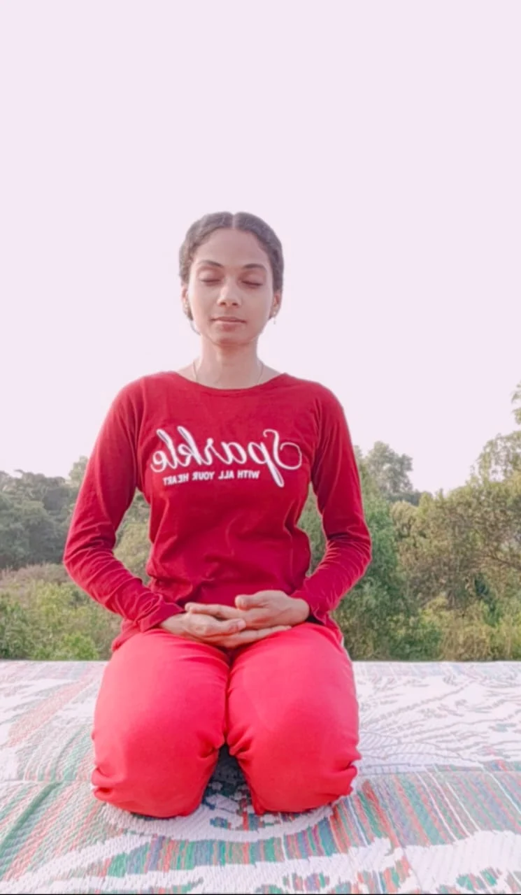 Poornima, sunbathing while meditating on her terrace