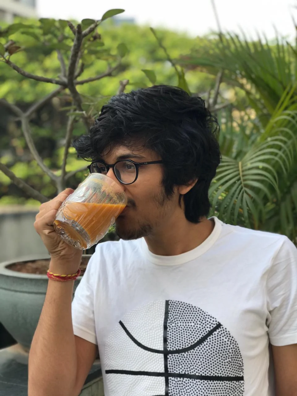 Jatan enjoying fresh carrot and tomato juice